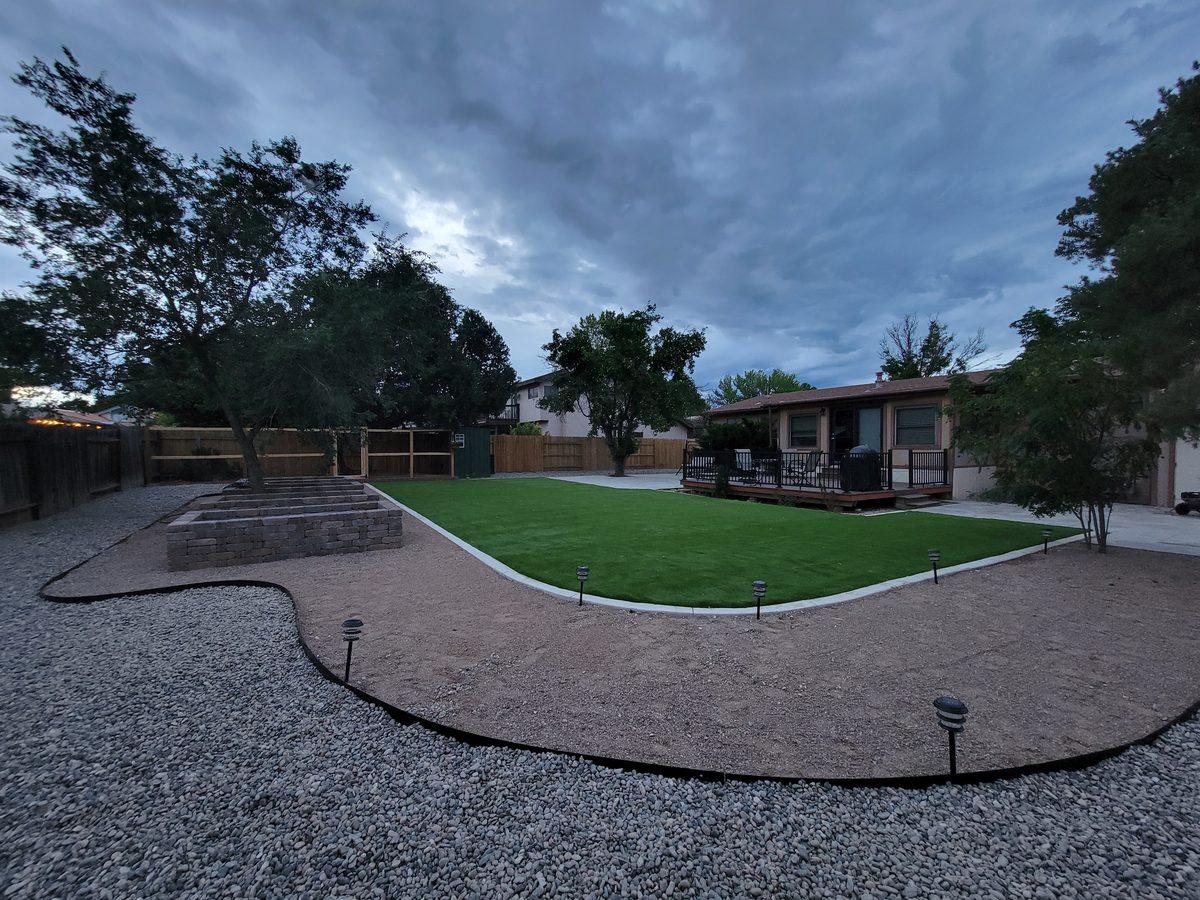 After - turf, gravel, lighting, retaining wall