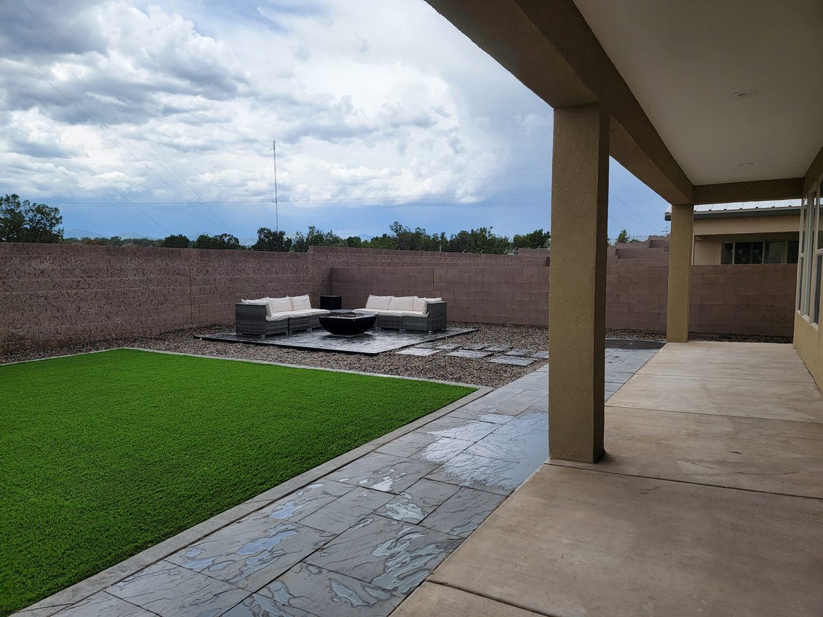 Backyard with turf and fire pit